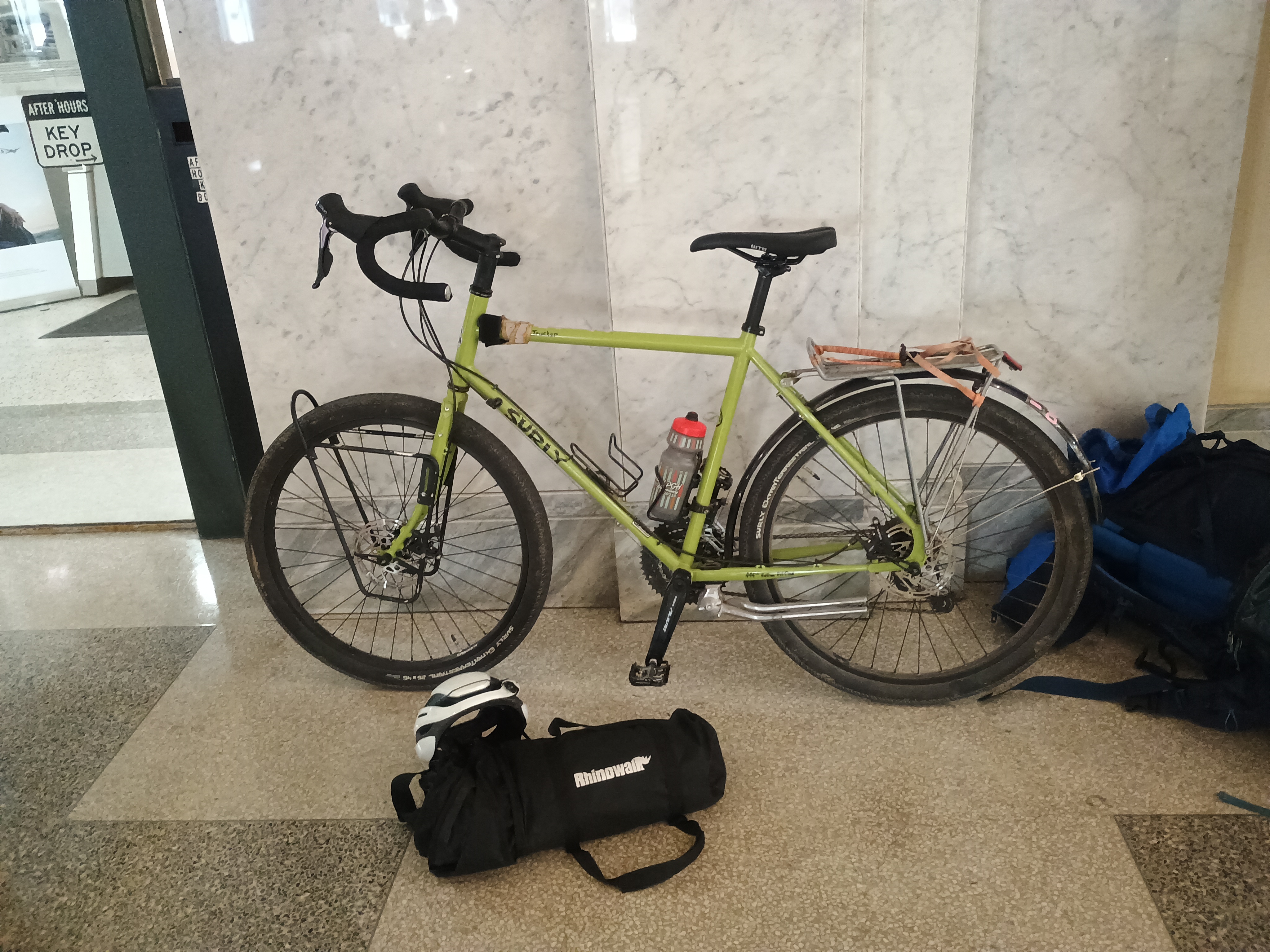 Bike and rolled-up bag at the station