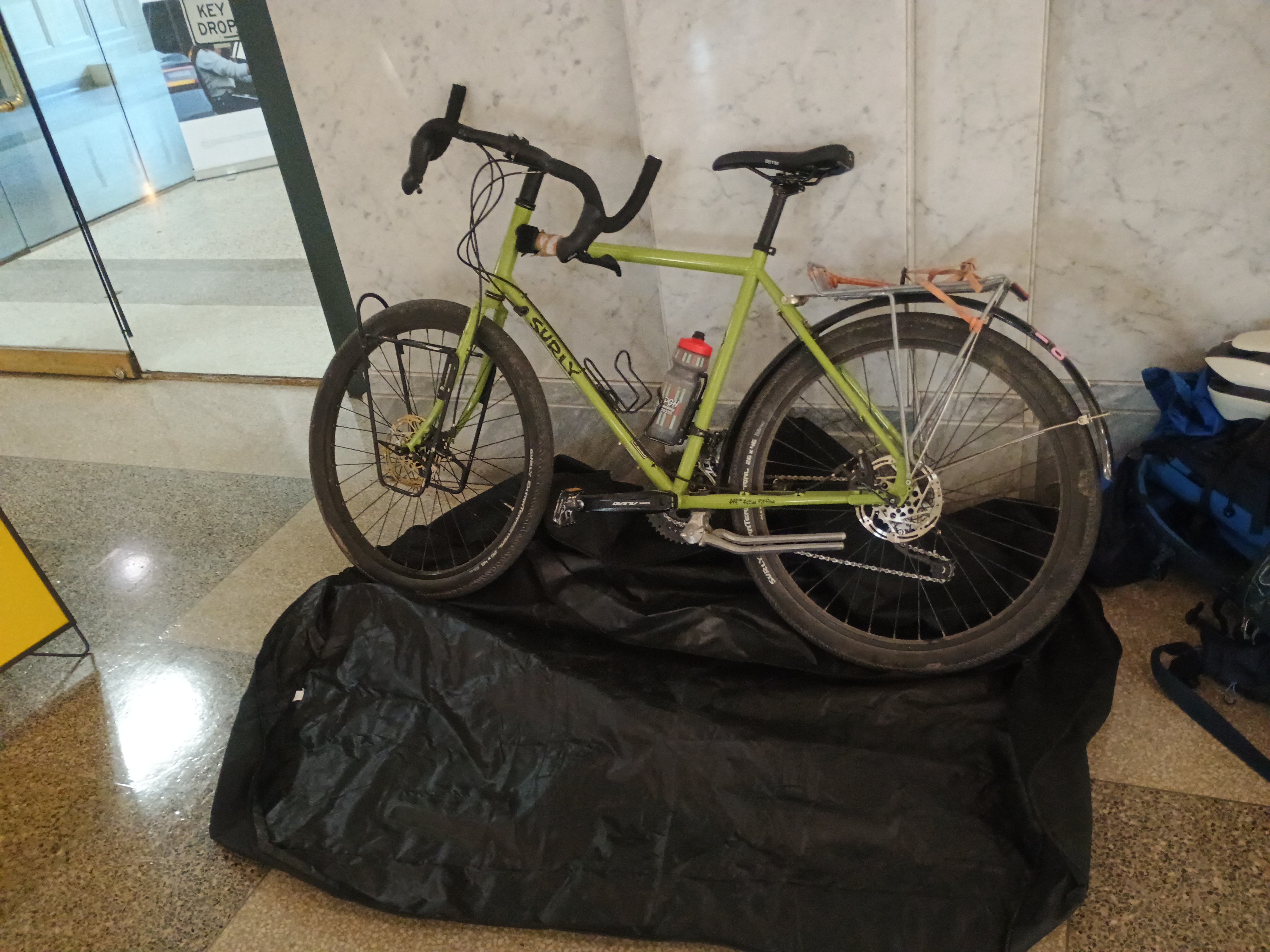 Front wheel removed, bag laid out beneath the bike