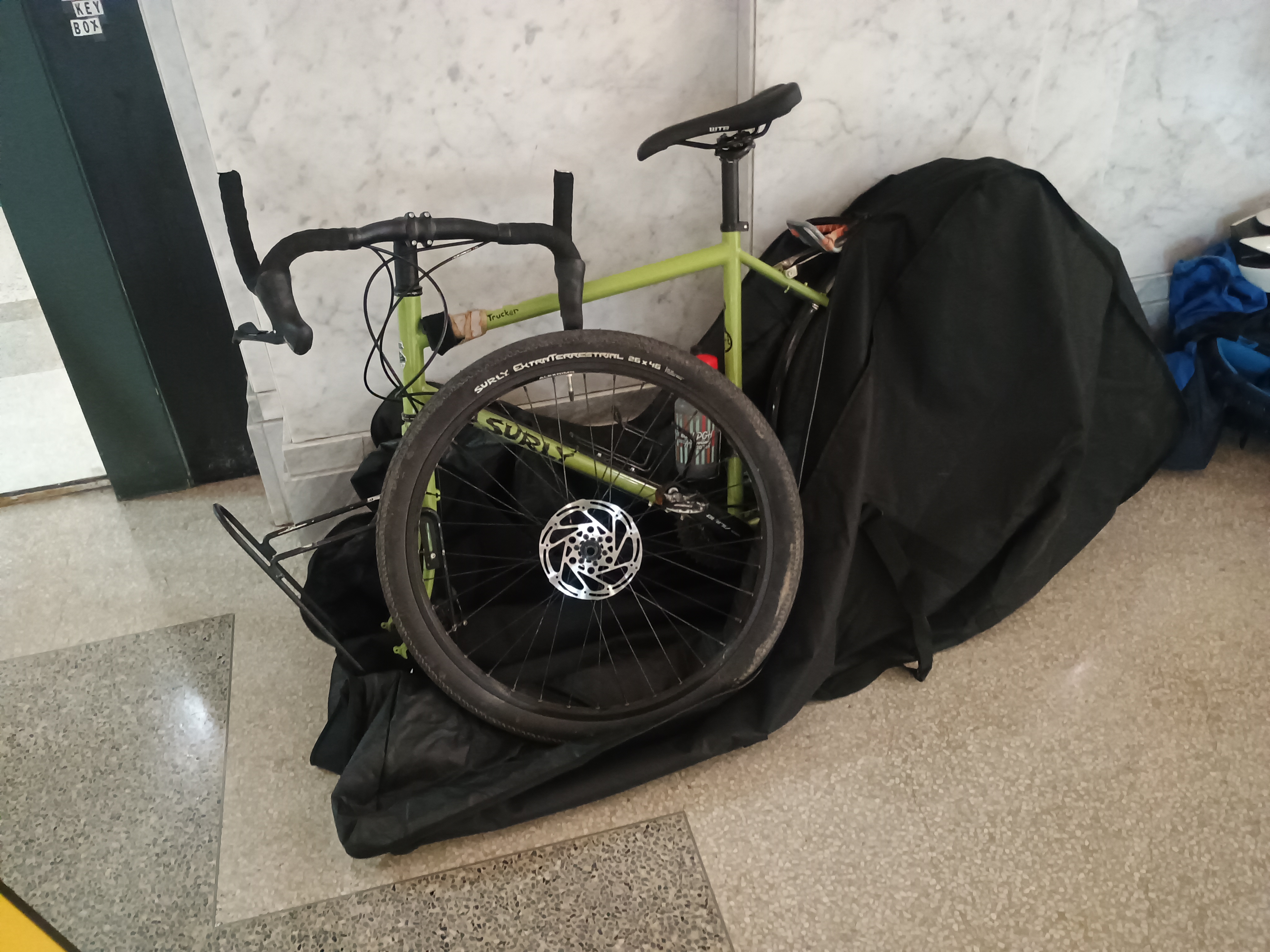 Front wheel beside the frame inside the bag