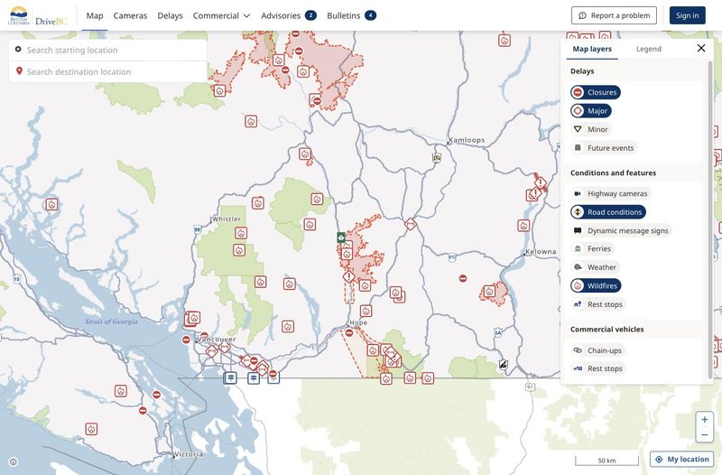 DriveBC map with the Wildfires layer on, showing fire perimeters near highways